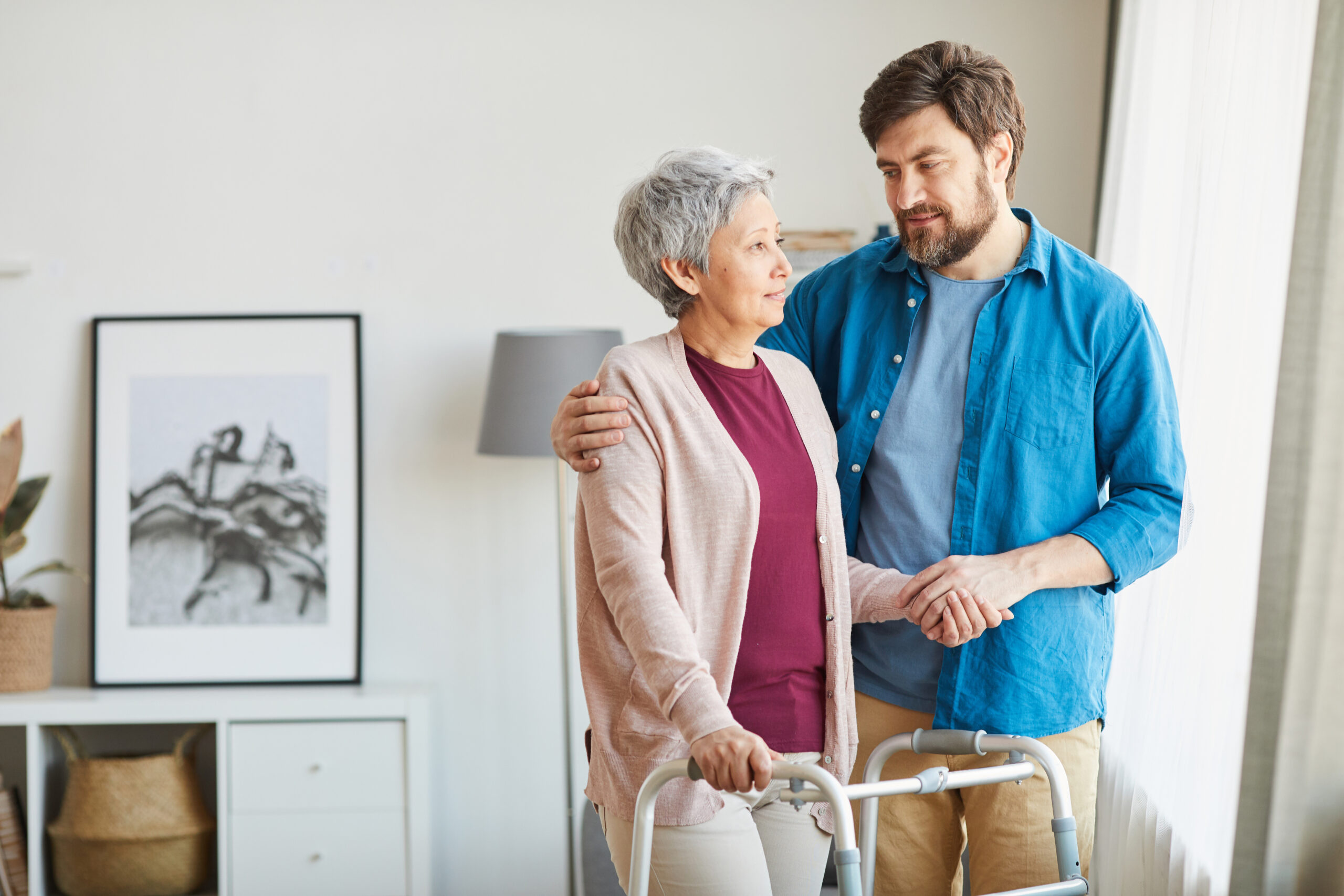 Elderly use walker during rehabilitation for safety